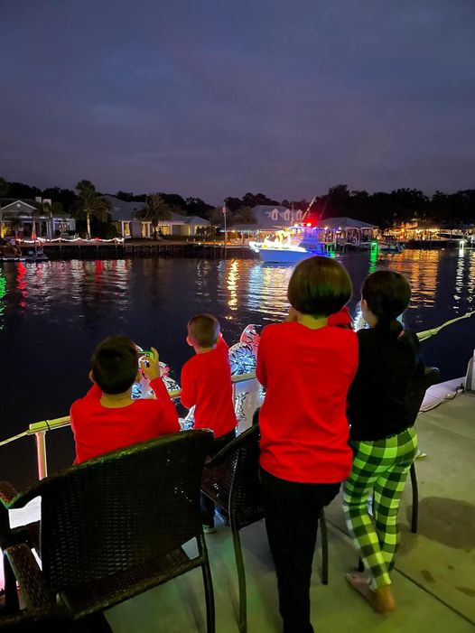 people watching a boat parade